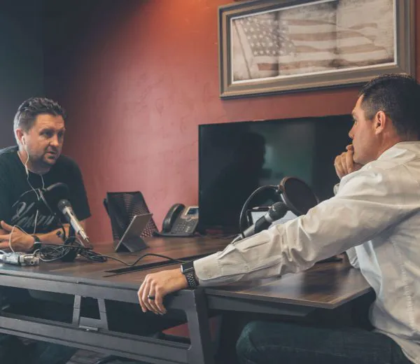 two men recording a podcast